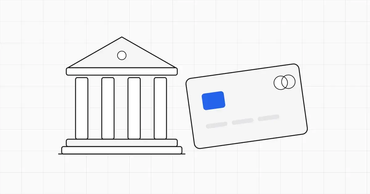 Line-art bank card resting in front of a small columned bank building, with one blue chip on the card
